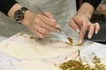 Handmade technique of applying the gold leaf. Gold gilding leaf decoration with brush, close up Royalty Free Stock Photo