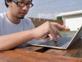 Selective focus on hands of asian man typing on keyboard of laptop. Royalty Free Stock Photo