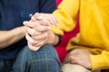 Selective focus at hands. Close up shot of young male homosexual or LGBT couple holding hands and embrace to show love expression Royalty Free Stock Photo