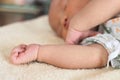 Selective focus on hands of cute newborn tiny Asian baby Royalty Free Stock Photo