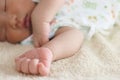 Selective focus on hands of cute newborn tiny Asian baby Royalty Free Stock Photo