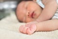 Selective focus on hands of cute newborn tiny Asian baby Royalty Free Stock Photo