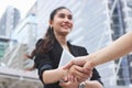 Selective focus on hands of success young Asian business woman and man shaking hands after deal. Partnership concept Royalty Free Stock Photo