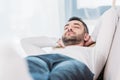 Selective focus of handsome bearded man resting with eyes closed. Royalty Free Stock Photo