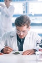 selective focus of handsome biochemist in Royalty Free Stock Photo