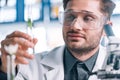 selective focus of handsome biochemist looking Royalty Free Stock Photo