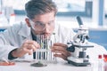 selective focus of handsome biochemist looking Royalty Free Stock Photo