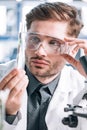 selective focus of handsome biochemist touching Royalty Free Stock Photo