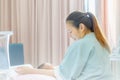 Selective focus of Happy asian mother looking newborn baby boy sleeping in hand at hospital Royalty Free Stock Photo