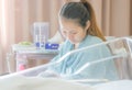 Selective focus of Happy asian mother looking newborn baby boy sleeping in hand at hospital Royalty Free Stock Photo