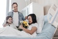 Selective focus on happy woman getting family support in hospital Royalty Free Stock Photo