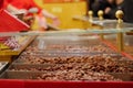 Heap of roasted almond on the stall at Christmas market. Royalty Free Stock Photo