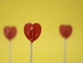 heart lollipop on yellow background