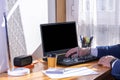 Selective focus of a home-based businessman with teleworking and chained to the computer