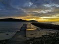 Beautiful seascape view with wooden jetty during sunset at Kota Belud beach,Sabah.