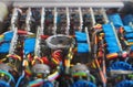 Selective focus image of complex colored wiring and connectors joining circuit boards with electrical components