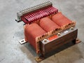 Motor starting auto transformer on the factory concrete floor. Royalty Free Stock Photo