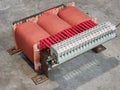 Motor starting auto transformer on the factory concrete floor. Royalty Free Stock Photo