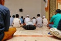 Prayers keep their distance while praying inside the mosque to anticipate the Covid