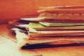 Selective focus image of records stack with record on top over wooden table. vintage filtered Royalty Free Stock Photo