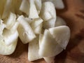 Sliced garlic on wooden cutting board Royalty Free Stock Photo