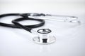 Selective focus image of stethoscope on a white background with blur background. Overexpose image, medical concept Royalty Free Stock Photo
