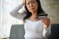 selective focus image, Stressed Asian mature woman having financial problems Royalty Free Stock Photo