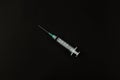 Selective focus image of syringe for injection that using for medical purpose isolated on a black background Royalty Free Stock Photo