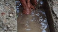 Selective focus image, workers clearing sewers from clogged trash