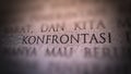 Selective focus of Indonesian word konfrontasi or confrontation in English, engraved on the wall Royalty Free Stock Photo