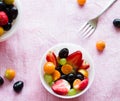 Selective focus on isolated bowl of healthy,fresh,juicy berries - Cape Gooseberry,Strawberries and Grapes. Royalty Free Stock Photo