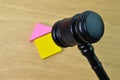 Selective focus of judge gavel and toy house over wooden background Royalty Free Stock Photo