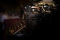 Selective focus on the keyboard and mechanism of an old black rustic typewriter on an office desk