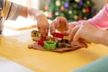 Selective focus. Kids making gingerbread cookies with various Christmas cookie cutters. Gingerbread dough. Family Christmas Royalty Free Stock Photo