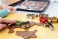 Selective focus. Kids making gingerbread cookies with various Christmas cookie cutters. Gingerbread dough. Family Christmas Royalty Free Stock Photo