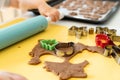 Selective focus. Kids making gingerbread cookies with various Christmas cookie cutters. Gingerbread dough. Family Christmas Royalty Free Stock Photo