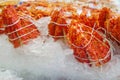 Selective focus of king crab leg on ice at fish market. Portion of king crab leg ready to sell at seafood shop. Royalty Free Stock Photo