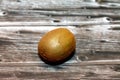 Chinese gooseberry is the edible berry of several species of woody vines in the genus Actinidia isolated on wooden Royalty Free Stock Photo