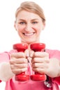 Selective focus of lady wearing scrubs training with weights Royalty Free Stock Photo