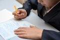 Selective focus of little boy learning how to write his name, Kid study at home, Children do homework at home, Concept for toddler Royalty Free Stock Photo