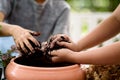 Young boy play with soil and seedling Royalty Free Stock Photo