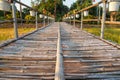 selective focus long bamboo bridge on the rice farm paddy Royalty Free Stock Photo