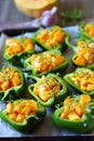 Green peppers stuffed with pumpkin. Selective focus. Macro.