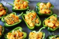 Green peppers stuffed with pumpkin. Selective focus. Macro.