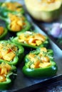 Green peppers stuffed with pumpkin. Selective focus. Macro.