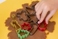 Selective focus. Making gingerbread cookies with various Christmas cookie cutters. Gingerbread dough. Family Christmas moments Royalty Free Stock Photo