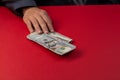 Selective focus,Man offering batch of hundred dollar bills. Hands close up. Venality, bribe, corruption concept. Hand giving money Royalty Free Stock Photo