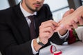 selective focus of man wearing wedding ring on girlfriend Royalty Free Stock Photo