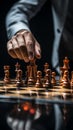 Selective focus Mans hand in chess play, metaphorically guiding strategic business decisions