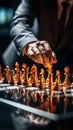 Selective focus Mans hand in chess play, metaphorically guiding strategic business decisions
